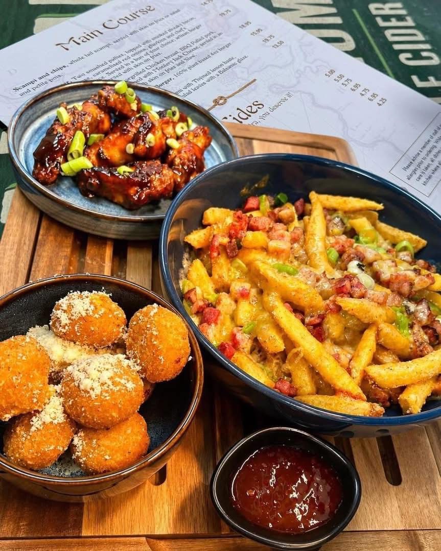 Sticky glazed chicken wings with loaded bacon and cheese fries